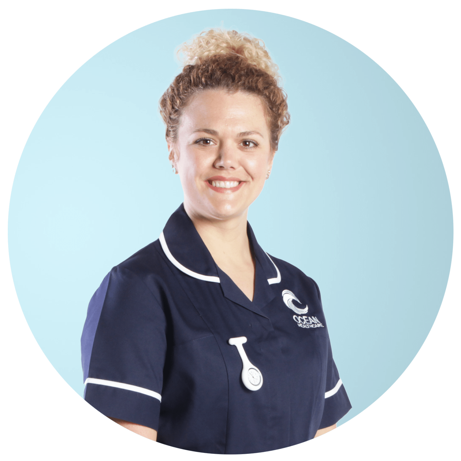 Smiling nurse in Ocean Healthcare uniform.